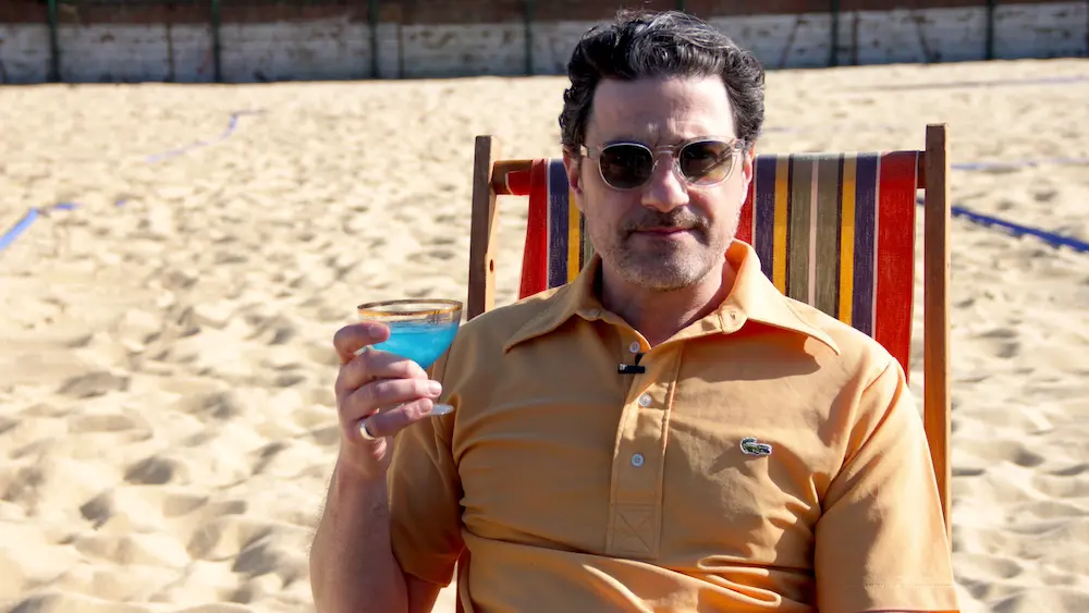 'Scams: Don't Get Caught Out' Presenter Alexis Conran in a deckchair.