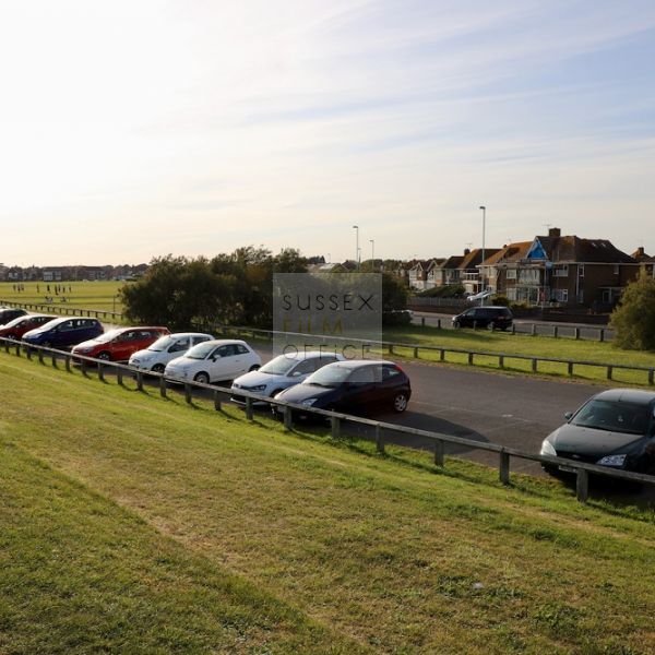 Goring Car Park - Seafront - Grass Area - Cars - Houses